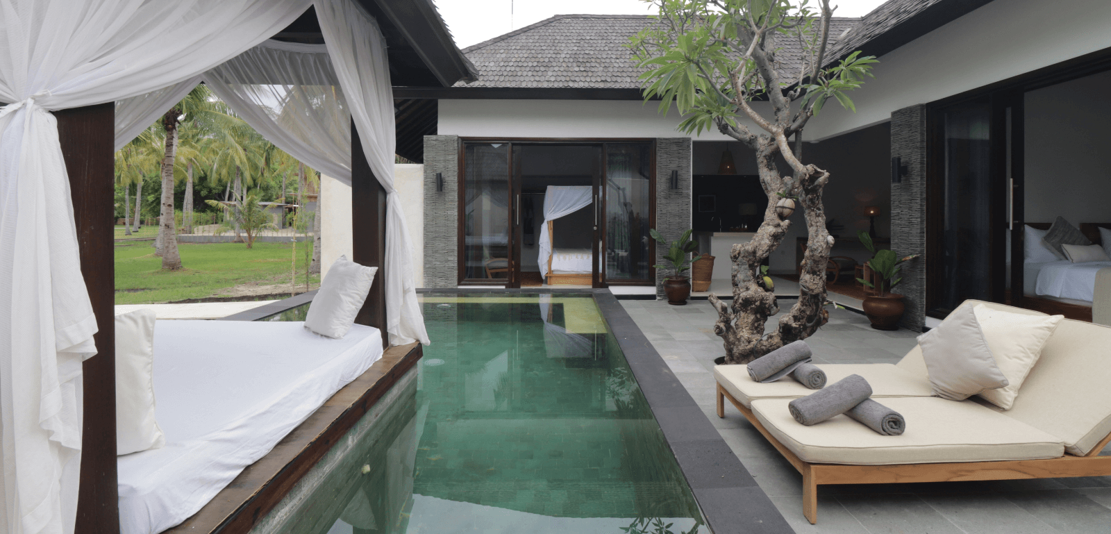 2-bedroom pool villa at Pondok Santi Estate with a living room, private pool, gazebo, and garden view, offering a peaceful retreat.