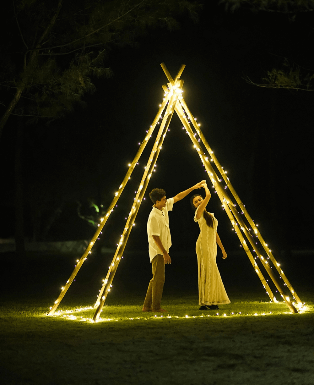 Couple dancing under romantic dinner setup at Pondok Santi Estate, Gili Trawangan.