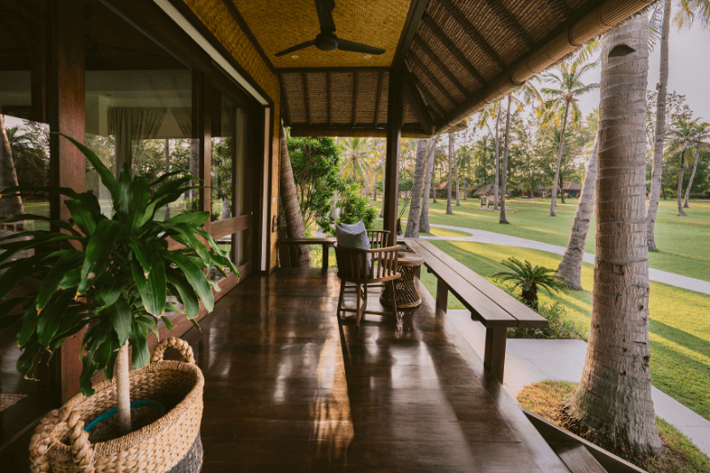 Beautiful terrace of the Ocean Private Pool Villa at Pondok Santi Estate, Gili Trawangan, with comfortable chairs and a stunning estate view.