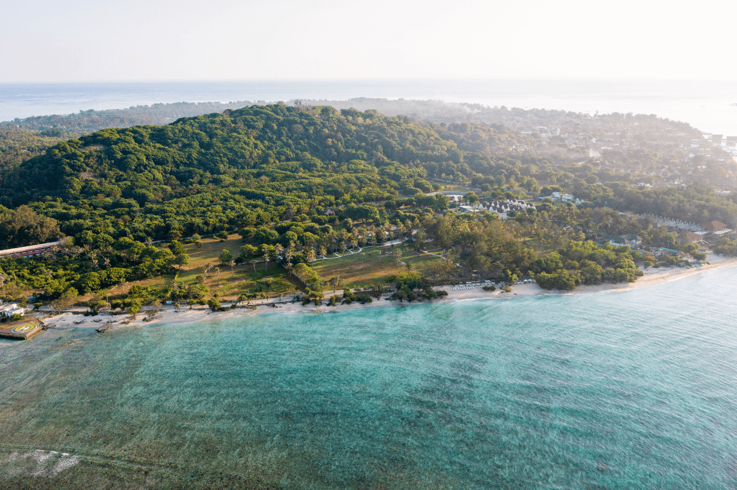 Drone view of Pondok Santi Estate on Gili Trawangan, with beach, ocean, and the island landscape.